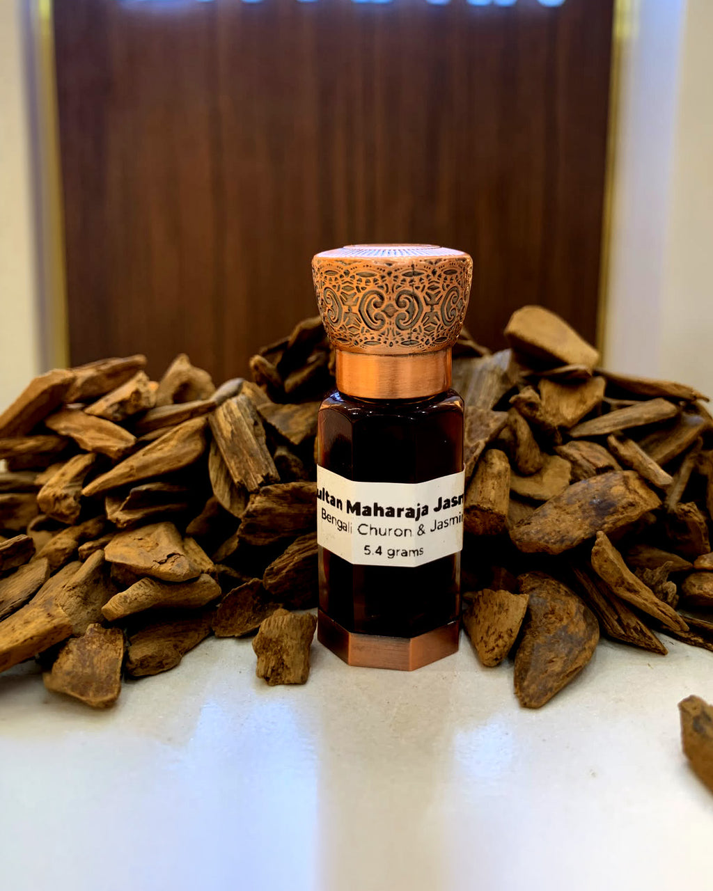 Sultan Maharaja Jasmine attar in a copper-capped bottle with Hindi agarwood